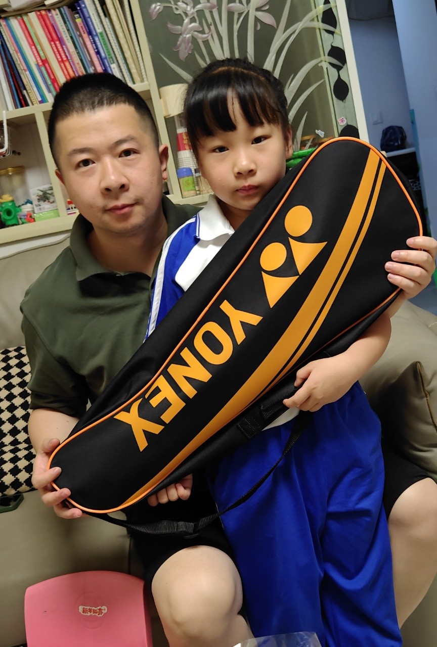 Employee's child receiving a Children's Day gift